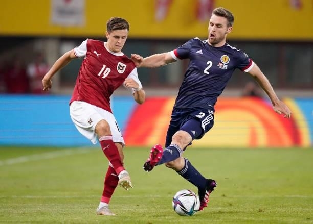 Christoph Baumgartner of Austria makes a pass whilst under pressure from Stephen O'Donnell of Scotland during the 2022 FIFA World Cup Qualifier match...