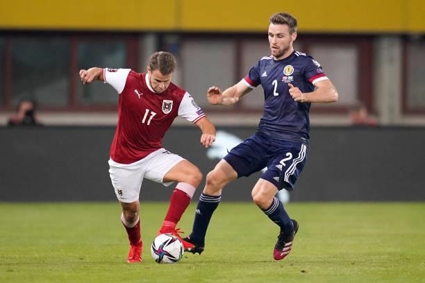 Louis Schaub of Austria battles for possession with Stephen O'Donnell of Scotland during the 2022 FIFA World Cup Qualifier match between Austria and...