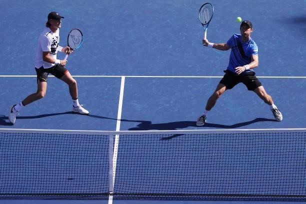 Max Purcell of Australia and Matthew Eden of Australia play against Rajeev Ram of the United States and Joe Salisbury of Great Britain during their...