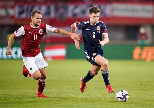 Kieran Tierney of Scotland battles for possession with Louis Schaub of Austria during the 2022 FIFA World Cup Qualifier match between Austria and...