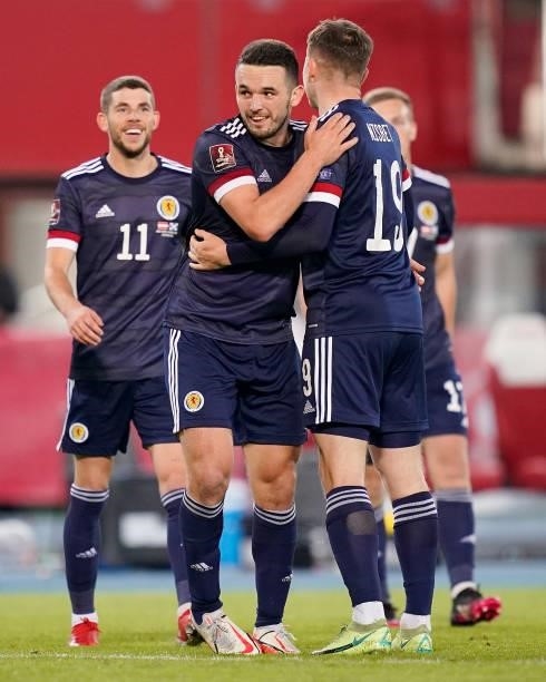 John McGinn and Kevin Nisbet of Scotland celebrate their side's victory after the 2022 FIFA World Cup Qualifier match between Austria and Scotland at...
