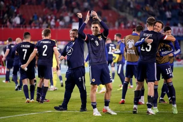 Lyndon Dykes of Scotland applauds the fans following their side's victory after the 2022 FIFA World Cup Qualifier match between Austria and Scotland...