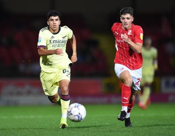 Salah-Eddine Oulad M'hand of Arsenal takes on Harry Parsons of Swindon during the Football League Trophy group N match between Swindon Towna and...