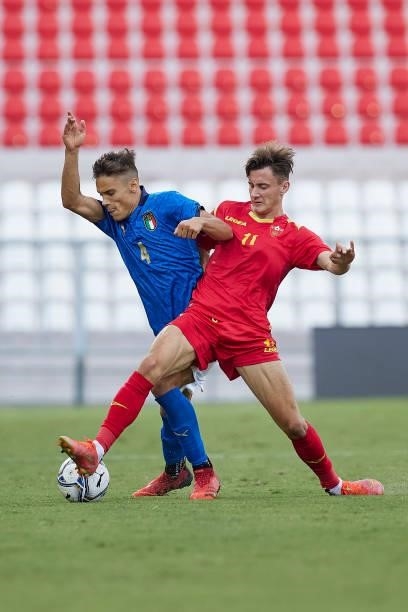 Samuele Ricci of Italy competes for the ball with Omar Sijaric of Montenegro during the UEFA European Under-21 Championship Qualifier between Italy...