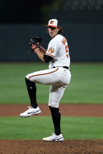 Mike Baumann of the Baltimore Orioles throws the first pitch of his MLB debut to batter Nicky Lopez of the Kansas City Royals during the fifth inning...