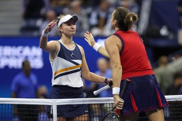 Aryna Sabalenka of Belarus meets at the net after defeating Barbora Krejcikova of Czech Republic during her Women's Singles quarterfinals match on...