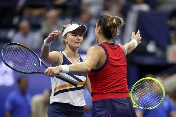 Aryna Sabalenka of Belarus meets at the net after defeating Barbora Krejcikova of Czech Republic during her Women's Singles quarterfinals match on...