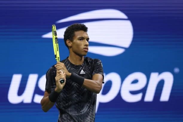 Felix Auger-Aliassime of Canada returns against Carlos Alcaraz of Spain during his Men’s Singles quarterfinals match on Day Nine of the 2021 US Open...
