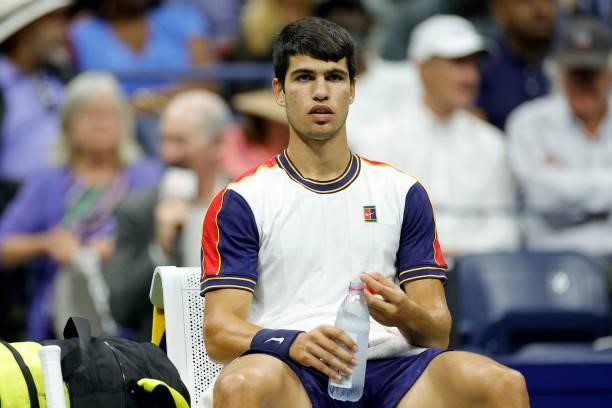 Carlos Alcaraz of Spain looks on from his chair during his Men’s Singles quarterfinals match against Felix Auger-Aliassime of Canada on Day Nine of...