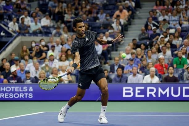 Felix Auger-Aliassime of Canada returns against Carlos Alcaraz of Spain during his Men’s Singles quarterfinals match on Day Nine of the 2021 US Open...