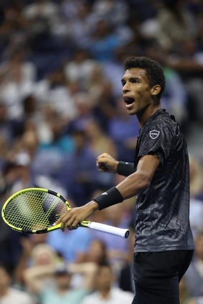 Felix Auger-Aliassime of Canada reacts to winning the first set against Carlos Alcaraz of Spain during his Men’s Singles quarterfinals match on Day...