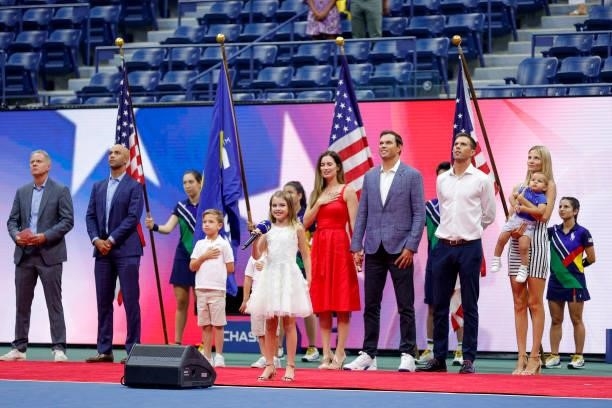 Micaela Bryan, daughter of Bob Bryan, performs the National Anthem prior to the Women's Singles quarterfinals match between Barbora Krejcikova of...