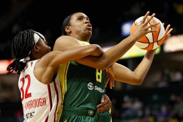 Shatori Walker-Kimbrough of the Washington Mystics fouls Kennedy Burke of the Seattle Storm during the fourth quarter at Angel of the Winds Arena on...