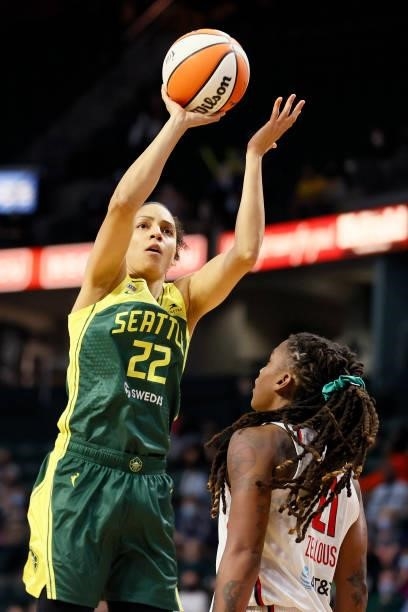 Cierra Burdick of the Seattle Storm shoots against Shavonte Zellous of the Washington Mystics during the fourth quarter at Angel of the Winds Arena...