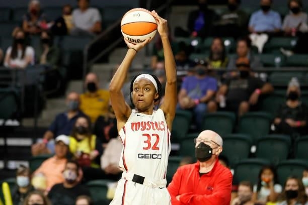 Shatori Walker-Kimbrough of the Washington Mystics shoots a three point basket against the Seattle Storm during the second quarter at Angel of the...
