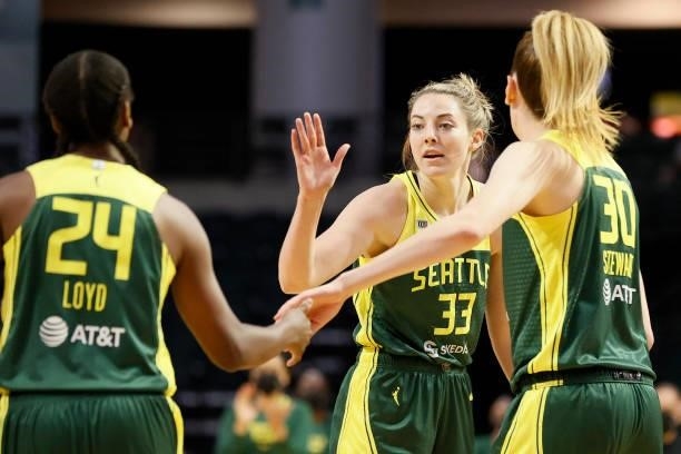 Jewell Loyd, Katie Lou Samuelson and Breanna Stewart of the Seattle Storm high five during the first quarter against the Washington Mystics at Angel...