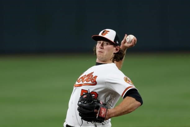 Mike Baumann of the Baltimore Orioles throws to a Kansas City Royals batter during his MLB debut in the fifth inning at Oriole Park at Camden Yards...