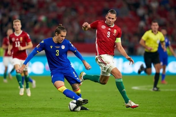 Adam Szalai of Hungary competes for the ball with Albert Alavedra of Andorra during the 2022 FIFA World Cup Qualifier match between Hungary and...