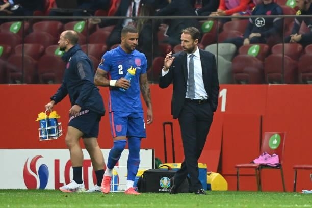 Gareth Southgate, Head Coach of England talks to Kyle Walker of England during the 2022 FIFA World Cup Qualifier match between Poland and England at...