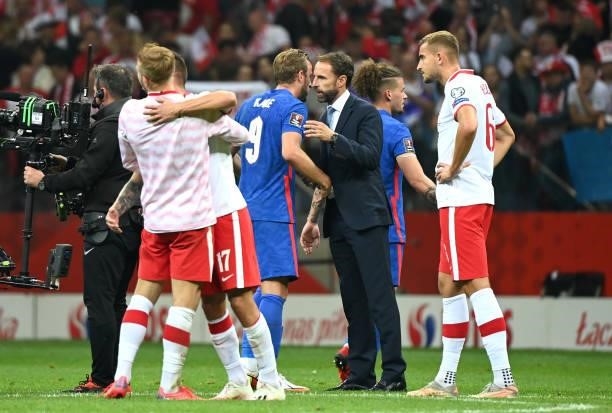 Gareth Southgate, Head Coach of England shakes hands with Harry Kane of England following the 2022 FIFA World Cup Qualifier match between Poland and...