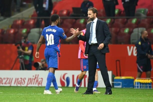 Raheem Sterling of England shakes hands with Gareth Southgate, Head Coach of England following the 2022 FIFA World Cup Qualifier match between Poland...