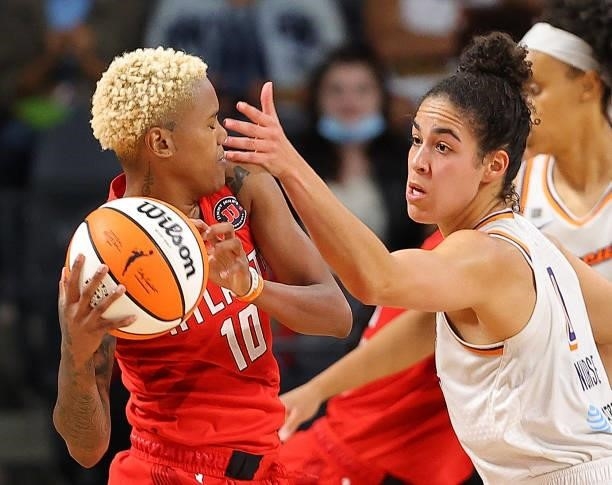 Courtney Williams of the Atlanta Dream is defended by Kia Nurse of the Phoenix Mercury during the second half at Gateway Center Arena on September...