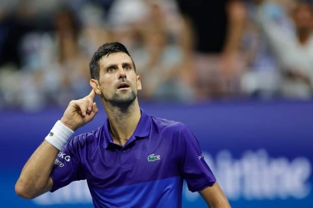Novak Djokovic of Serbia reacts to the crowd as he plays against Matteo Berrettini of Italy during his Men's Singles quarterfinal match on Day Ten of...