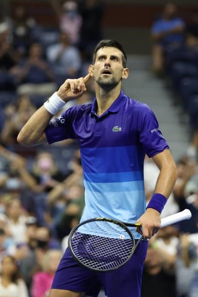 Novak Djokovic of Serbia reacts to the crowd as he plays against Matteo Berrettini of Italy during his Men's Singles quarterfinal match on Day Ten of...