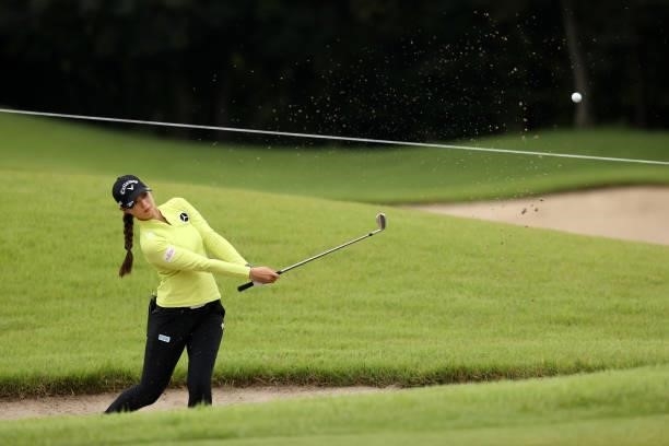 Asuka Kashiwabara of Japan hits out from a bunker on the 8th hole during the first round of the JLPGA Championship Konica Minolta Cup at Shizu Hills...
