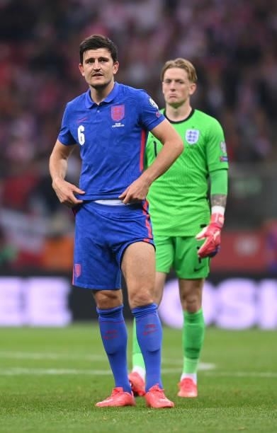 Harry Maguire and Jordan Pickford of England look on during the 2022 FIFA World Cup Qualifier between Poland and England at Stadion Narodowy on...