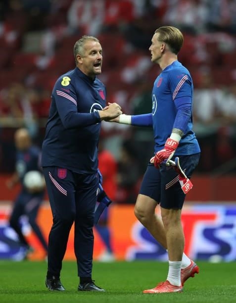 England goalkeeping coach Martyn Margetson talks to Jordan Pickford of England before the game against Poland at Stadion Narodowy on September 08,...