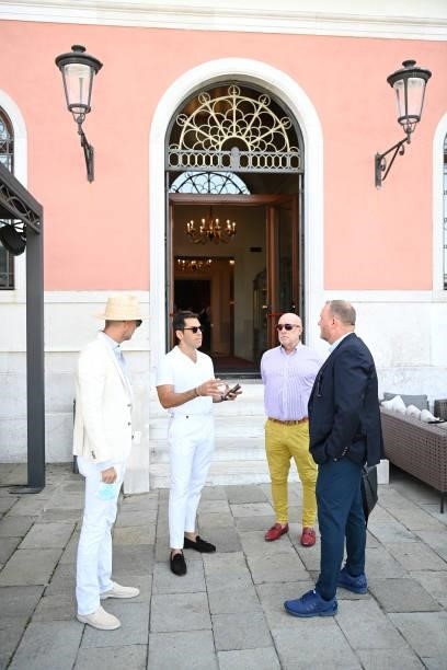 Andy Boose, Emir Uyar, Donald Dye and Kevin Robert Frost attend a luncheon hosted by amfAR during the 78th Venice International Film Festival on...