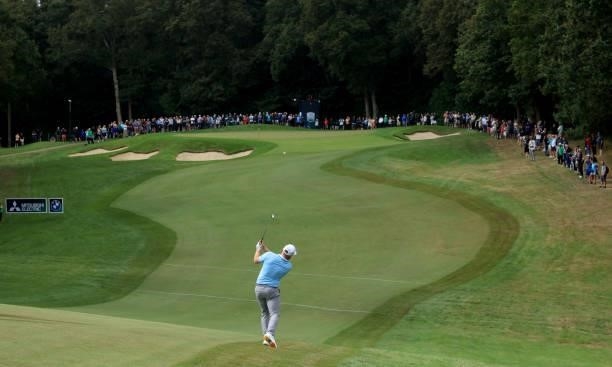 Tyrrell Hatton of England plays his second shot on the first hole during the first round of The BMW PGA Championship at Wentworth Golf Club on...
