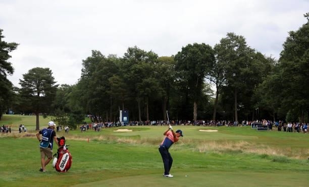 Padraig Harrington of Ireland plays his second shot on the 15th hole during the first round of The BMW PGA Championship at Wentworth Golf Club on...