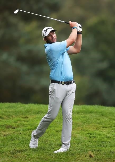 Dean Burmester of South Africa plays his second shot from the rough on the 13th hole during Day One of The BMW PGA Championship at Wentworth Golf...