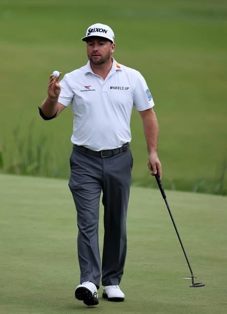 Graeme McDowell of Northern Ireland acknowledges the crowd, after he finishes his round during Day One of The BMW PGA Championship at Wentworth Golf...
