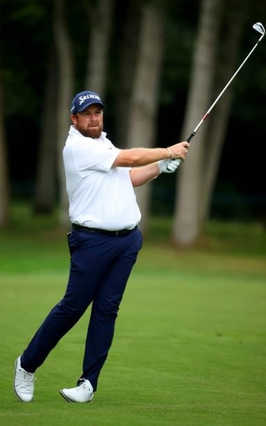 Shane Lowry of Ireland plays his second shot on the 17th hole during the first round of The BMW PGA Championship at Wentworth Golf Club on September...