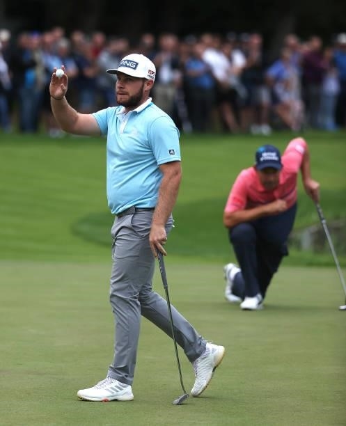 Tyrell Hatton of England acknowledges the crowd on the 18th green during Day One of The BMW PGA Championship at Wentworth Golf Club on September 09,...