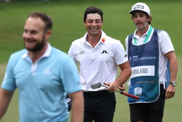 Viktor Hovland of Denmark smiles, as he walks off the 18th green during Day One of The BMW PGA Championship at Wentworth Golf Club on September 09,...