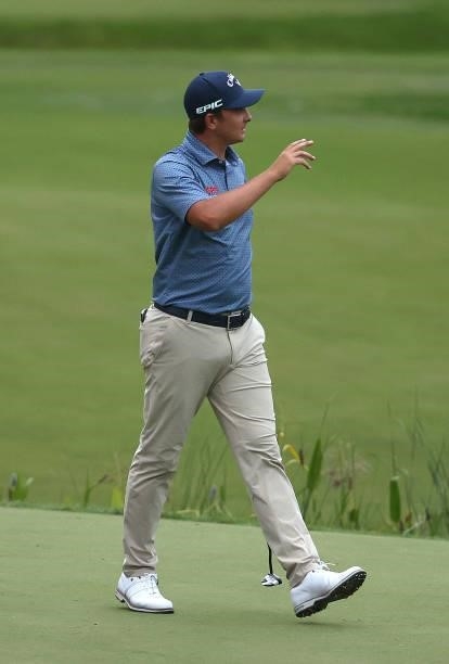 Christiaan Bezuidenhout of South Africa acknowledges the crowd, as he walks off the 18th green during Day One of The BMW PGA Championship at...