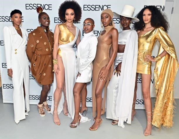 Designer Megan Carter and Caroline Wanga, CEO of ESSENCE, pose for a photo with models as they attend the ESSENCE Fashion House - Red Carpet on...