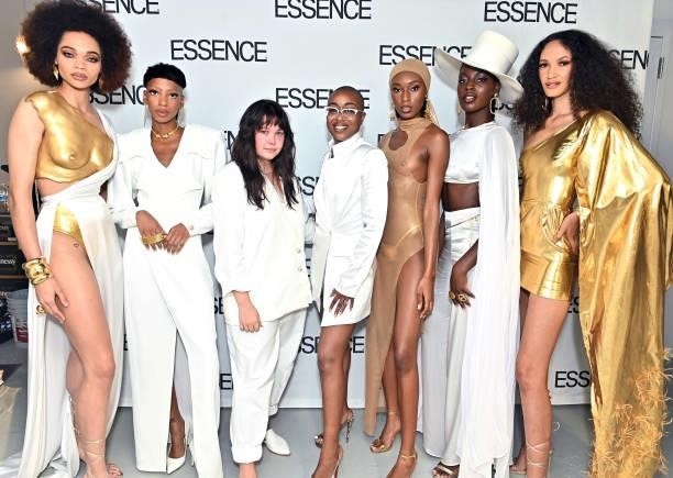 Designer Megan Carter poses for a photo with Tyler Brooke and models during ESSENCE Fashion House - Red Carpet on September 09, 2021 in New York City.