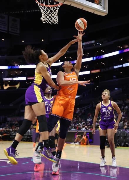 Brionna Jones of the Connecticut Sun takes a shot against Nia Coffey of the Los Angeles Sparks in the first quarter at Staples Center on September...
