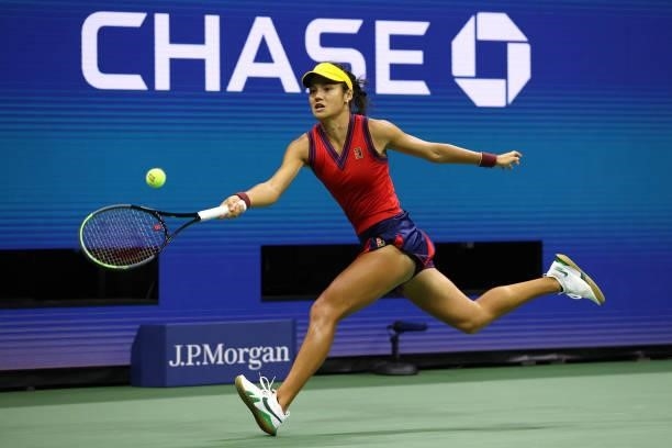 Emma Raducanu of Great Britain lunges to return the ball in the second set against Maria Sakkari of Greece during their Women’s Singles semifinals...