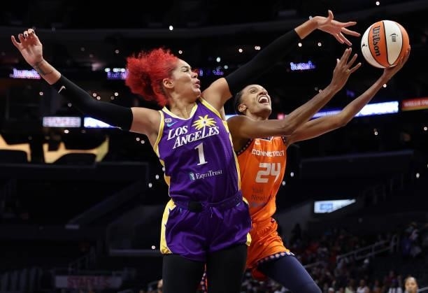 DeWanna Bonner of the Connecticut Sun takes a shot against Amanda Zahui B of the Los Angeles Sparks in the second quarter at Staples Center on...