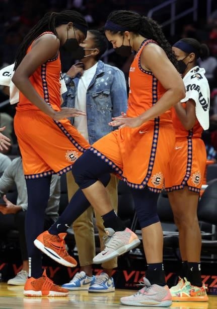 Jonquel Jones and Brionna Jones of the Connecticut Sun celebrate a win against the Los Angeles Sparks at Staples Center on September 09, 2021 in Los...