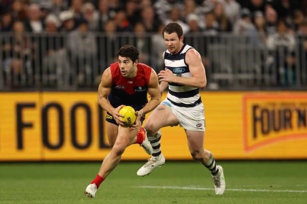 Christian Petracca of the Demons runs with the ball during the AFL First Preliminary Final match between Melbourne Demons and Geelong Cats at Optus...
