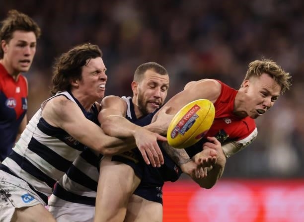 James Harmes of the Demons looks to keep the ball during the AFL First Preliminary Final match between Melbourne Demons and Geelong Cats at Optus...
