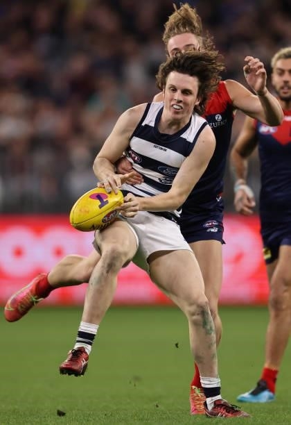 Max Holmes of the Cats looks to control the ball during the AFL First Preliminary Final match between Melbourne Demons and Geelong Cats at Optus...