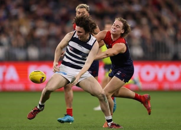 Max Holmes of the Cats looks to control the ball during the AFL First Preliminary Final match between Melbourne Demons and Geelong Cats at Optus...
